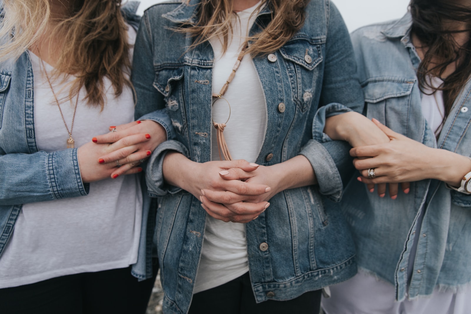 Photo by Becca Tapert woman in blue denim jacket and white shirt